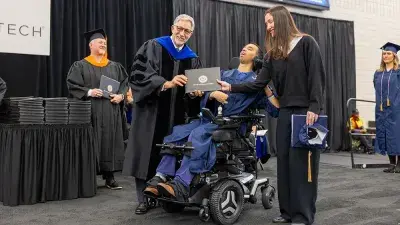 Wake Tech student process into the auditorium for the Fall 2025 commencement ceremony.