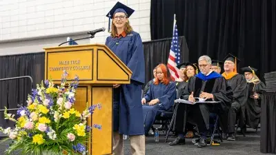 Wake Tech student process into the auditorium for the Fall 2025 commencement ceremony.