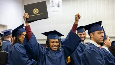 Wake Tech student process into the auditorium for the Fall 2025 commencement ceremony.