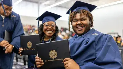 Wake Tech student process into the auditorium for the Fall 2025 commencement ceremony.