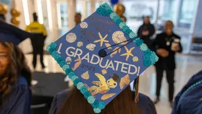 Wake Tech student process into the auditorium for the Fall 2025 commencement ceremony.