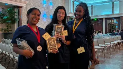 A female student in front of a computer at 2026 SkillsUSA North Carolina State Leadership & Skills Conference.