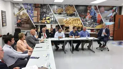 U.S. Education Secretary Linda McMahon talks with Wake Tech President Dr. Scott Ralls during a June 25, 2025, visit.