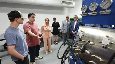 U.S. Education Secretary Linda McMahon talks with Wake Tech President Dr. Scott Ralls during a June 25, 2025, visit.