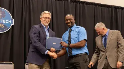 Wake Tech President Dr. Scott Ralls speaks to students who completed the non-degree Emergency Medical Technician–Paramedic program.