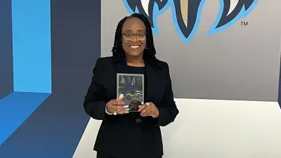 Dr. Saundra Williams, vice chair of the Wake Tech Board of Trustees, poses with her award.