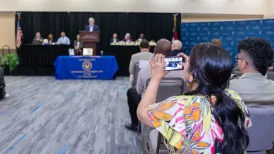 Wake County Commissioner Don Mial speaks during Wake Tech's Phi Theta Kappa induction ceremony.