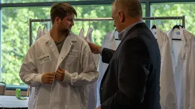 Wake Tech Biotechnology students show off their new lab coats.