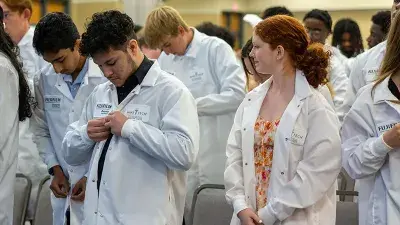 Wake Tech Biotechnology students show off their new lab coats.