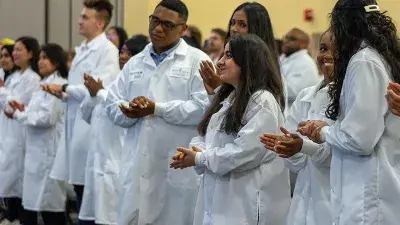 Wake Tech Biotechnology students show off their new lab coats.