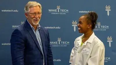 Wake Tech Biotechnology students show off their new lab coats.