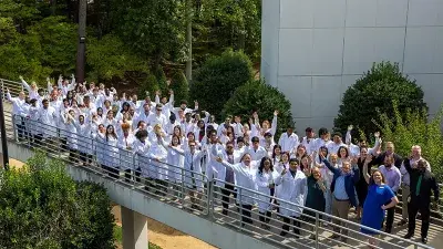Wake Tech Biotechnology students show off their new lab coats.