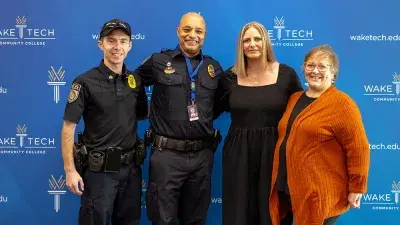 Police Chief Wyatt Cumbo, center, poses with Wake Tech President Dr. Scott Ralls and Executive Vice President Dr. Gayle Greene.