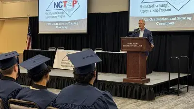 Wake Tech President Dr. Scott Ralls speaks to apprentices at the NCTAP ceremony.