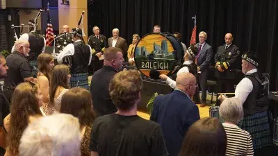 A bagpipe and drum group process in during the Wake County Fire Academy graduation ceremony.