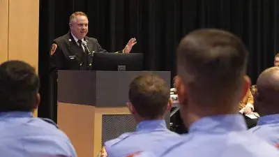 A bagpipe and drum group process in during the Wake County Fire Academy graduation ceremony.