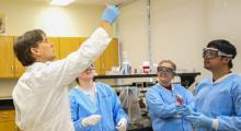 Teacher in lab teaching students